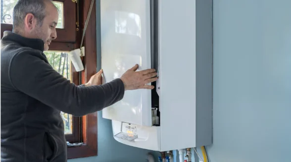 A-boiler-engineer-is-repairing-a-boiler-in-a-London-home