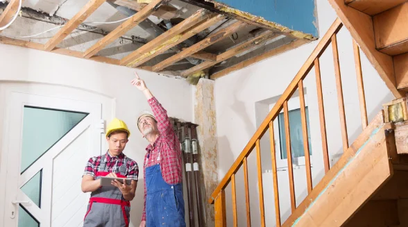 a-man-troubled-by-a-ceiling-leak-calling-for-help-out-of-desperation