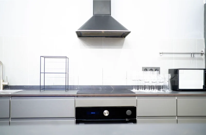 A-modern-kitchen-with-a-cooker-hood-in-the-middle