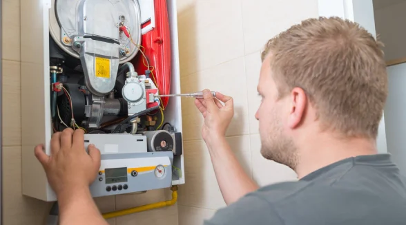 boiler-engineer-is-checking-a-gas-boiler