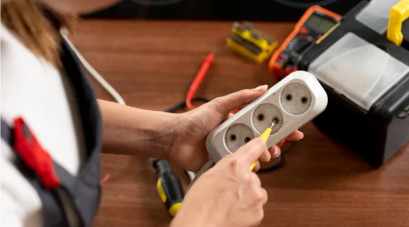 person-is-cleaning-and-checking-on-a-wall-socket