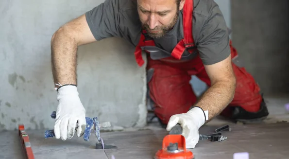 professional-tradesperson-is-fixing-grout-in-shower