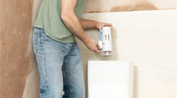 person-is-replacing-a-toilet-syphon