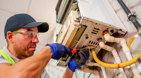 heating-engineer-is-repairing-a-boiler