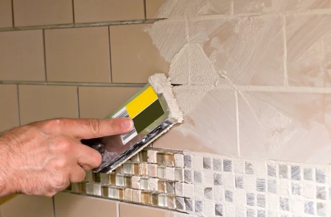 person-is-regrouting-tiles