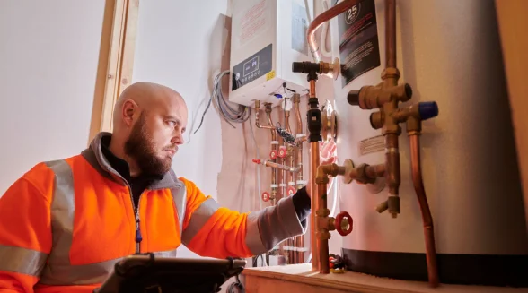 gas-heating-engineer-is-repairing-a-boiler-system