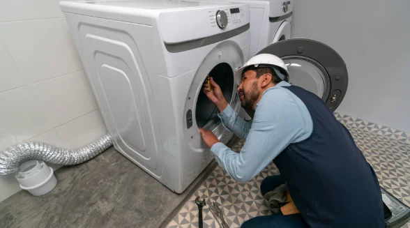 professional-technician-is-repairing-a-washing-machine