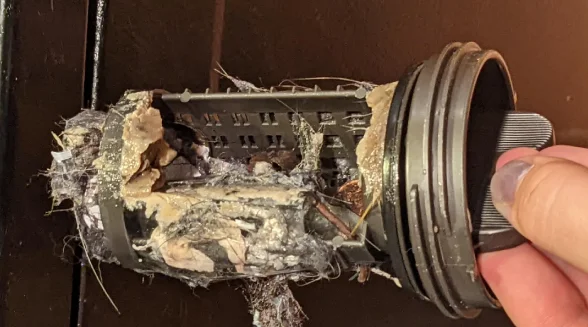closeup-of-a-dirty-washing-machine-filter