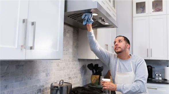 man-is-cleaning-a-cooker-hood