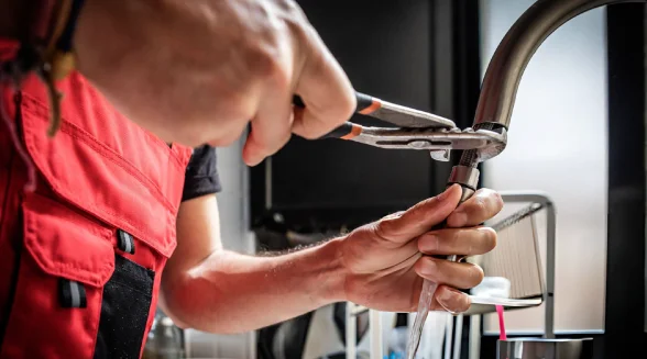 plumbing-engineer-is-fixing-a-hot-water-tap