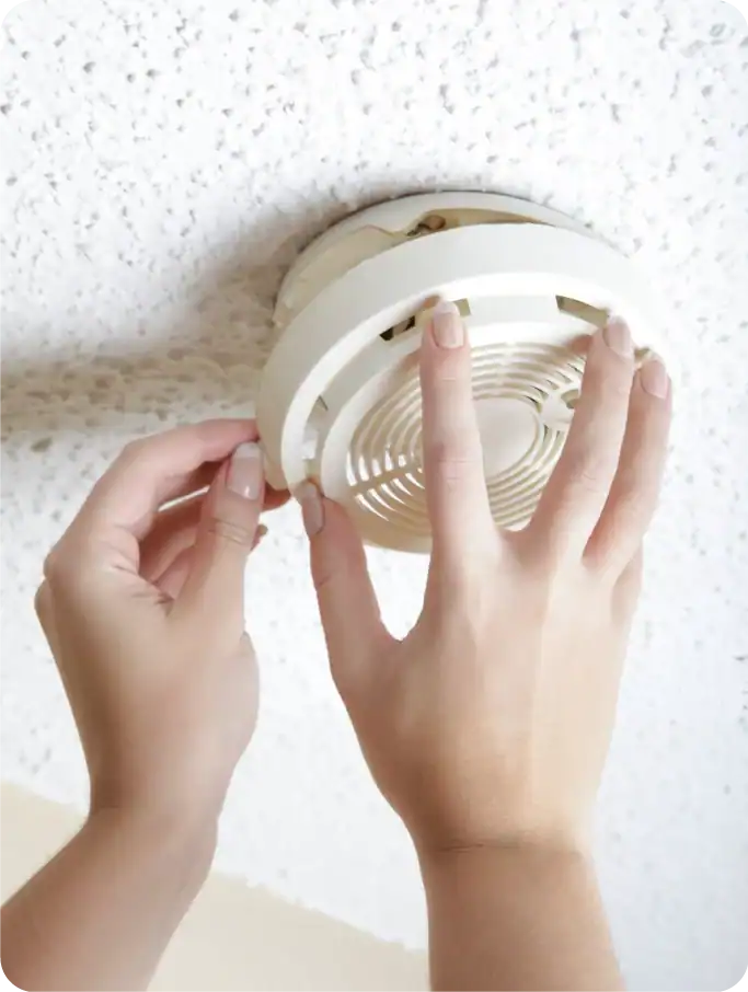 smoke-alarm-installer-installing-a-smoke-detector smoke-alarm-installer-installing-a-smoke-detector
