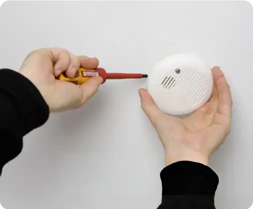engineer-working-on-a-co-and-smoke-alarm-installation engineer-working-on-a-co-and-smoke-alarm-installation