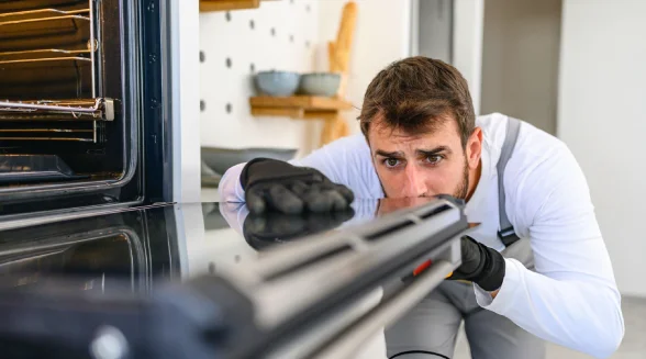 tradesperson-is-checking-an-oven