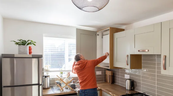 homeowner-is-checking-his-home-boiler