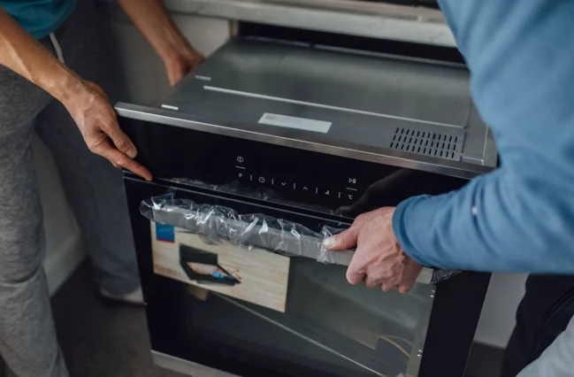 two-people-doing-appliance-installation