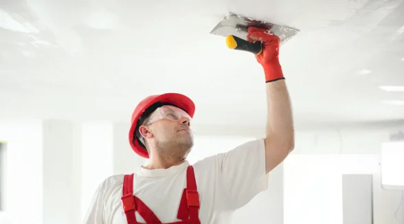 tradesperson-is-doing-bathroom-ceiling-plaster-repair