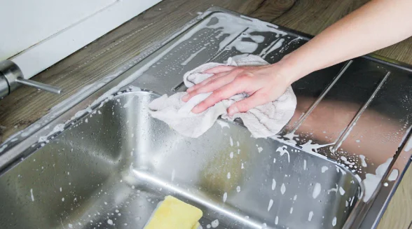 person-is-cleaning-a-sink