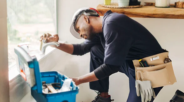 plumber-is-installing-a-faucet