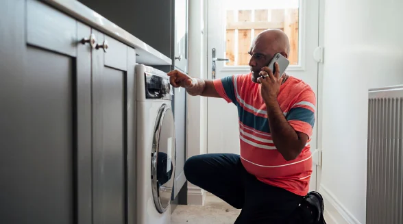 man-is-calling-a-washing-machine-repair-service
