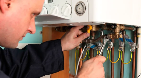 boiler-engineer-is-fixing-a-boiler-pipe
